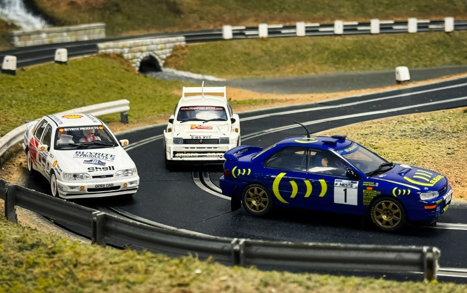 SCALEXTRIC C4612A Colin McRae - Triple Car Pack - Ford Sierra Sapphire RS Cosworth No.27 (1997), MG Metro 6R4 N.3 (2006), Subaru Impreza No.1 (1996)