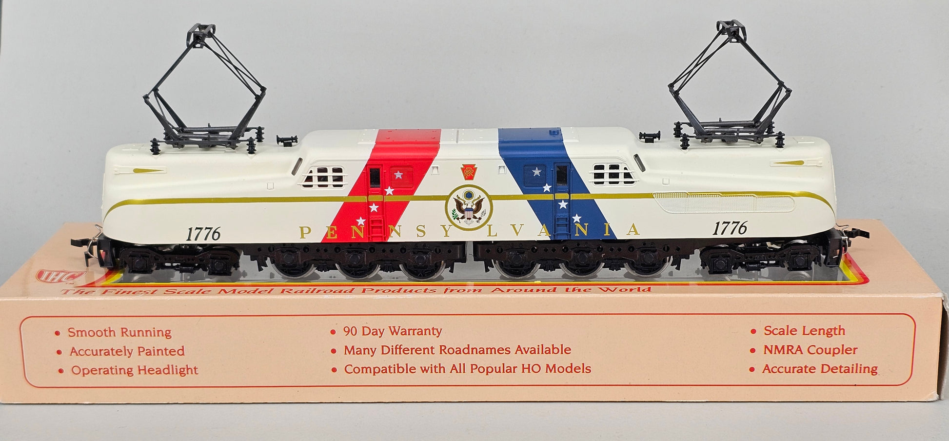 International Hobby Corp HO Scale M9666 GG-1 Premier PRR Spirit of '76 White with Red & Blue diagonal bands (DC Only) with working pantpgraph and directional lighting. - Chester Model Centre