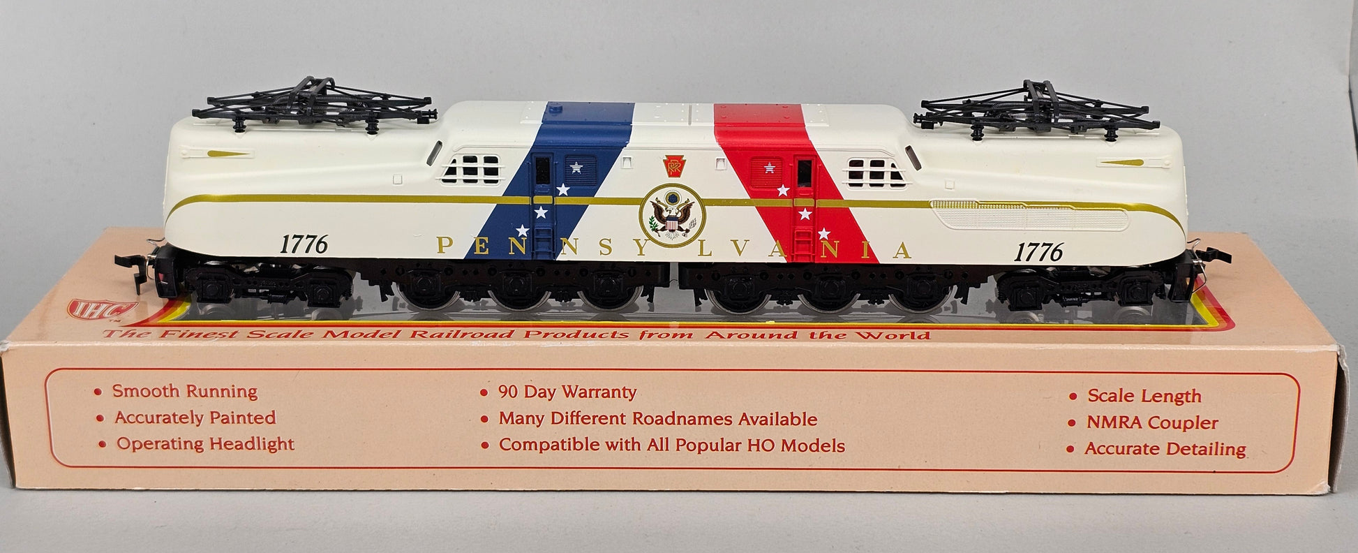 International Hobby Corp HO Scale M9666 GG-1 Premier PRR Spirit of '76 White with Red & Blue diagonal bands (DC Only) with working pantpgraph and directional lighting. - Chester Model Centre