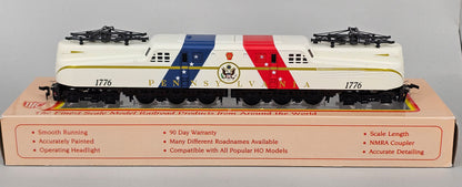 International Hobby Corp HO Scale M9666 GG-1 Premier PRR Spirit of '76 White with Red & Blue diagonal bands (DC Only) with working pantpgraph and directional lighting. - Chester Model Centre