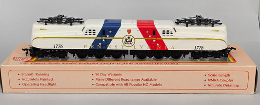 International Hobby Corp HO Scale M9666 GG-1 Premier PRR Spirit of '76 White with Red & Blue diagonal bands (DC Only) with working pantpgraph and directional lighting. - Chester Model Centre